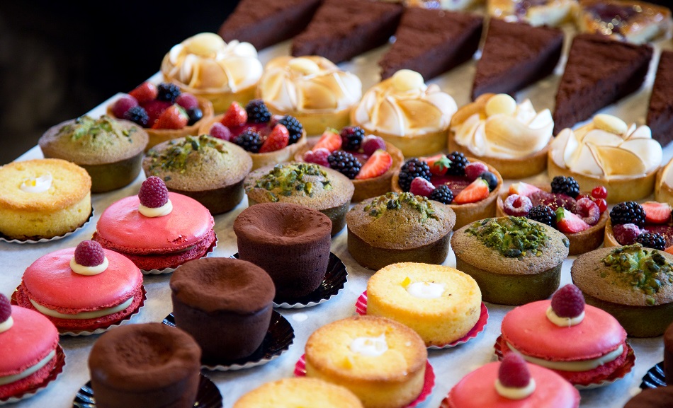 A selection of pastries and desserts in a bakery